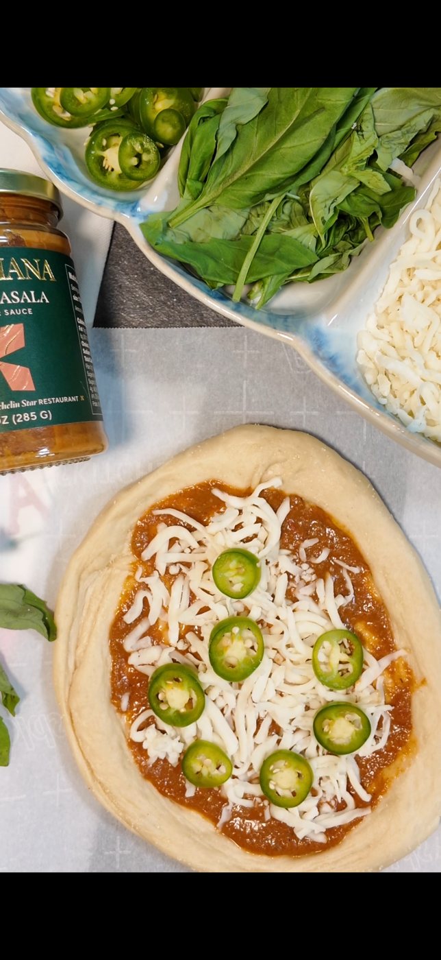 Butter masala pizza on homemade dough with mozzarella and jalapeños